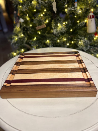Black Walnut, Purpleheart and Hard Maple side grain cutting board